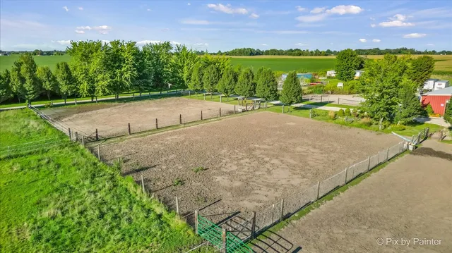 an aerial view of a house with big yard