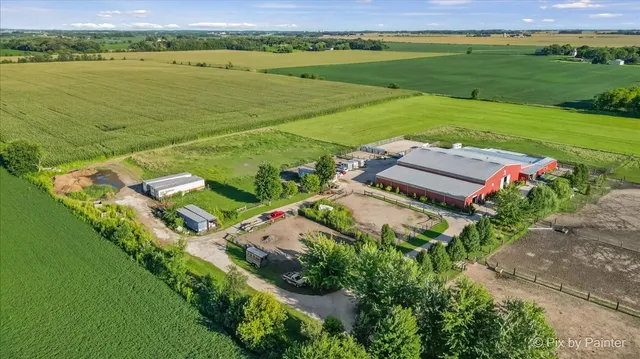 an aerial view of a house with a garden