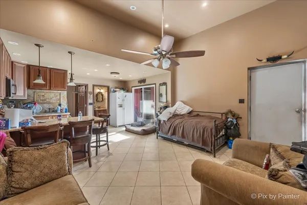 a living room with furniture and a chandelier