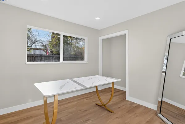 a workspace with furniture and wooden floor