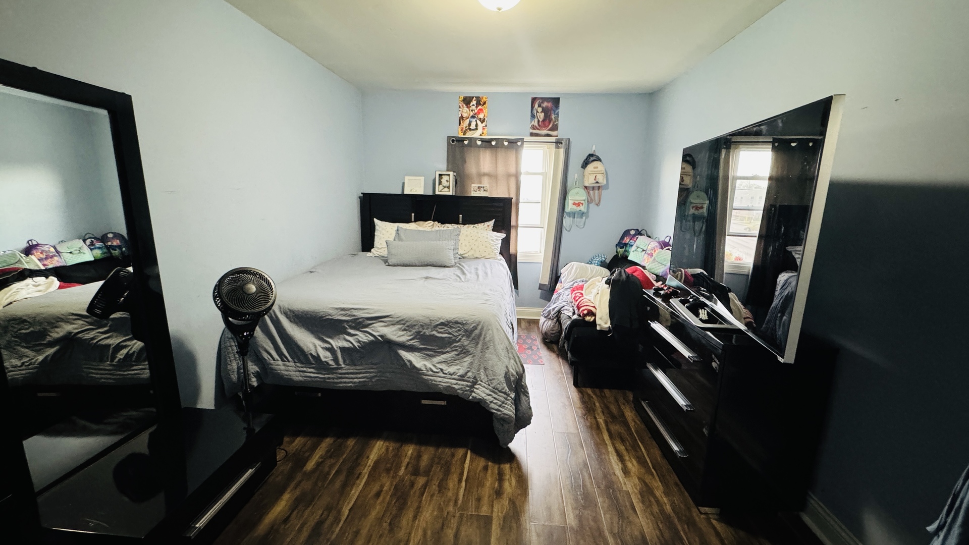 2420 Randolph Street Bellwood, IL 60104 - Photo 8 of 13 a bedroom with a bed and a mirror