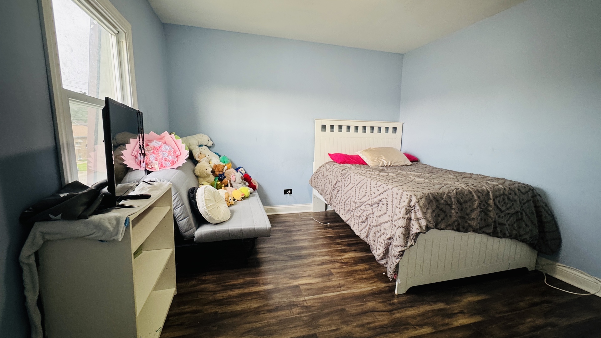 2420 Randolph Street Bellwood, IL 60104 - Photo 9 of 13 a bedroom with a bed dresser and window