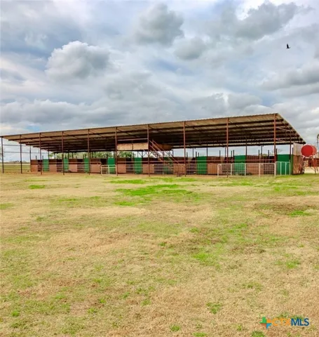 a view of a swimming pool with an outdoor seating