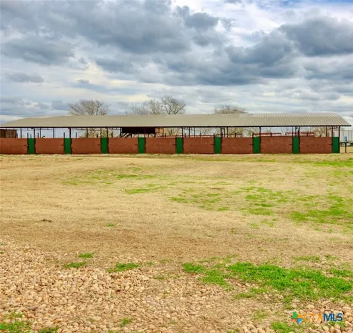 a view of a backyard of a house