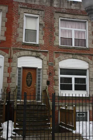 a brick building with a sign on it