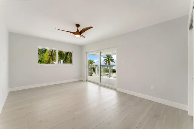 a view of a swimming pool with an outdoor seating