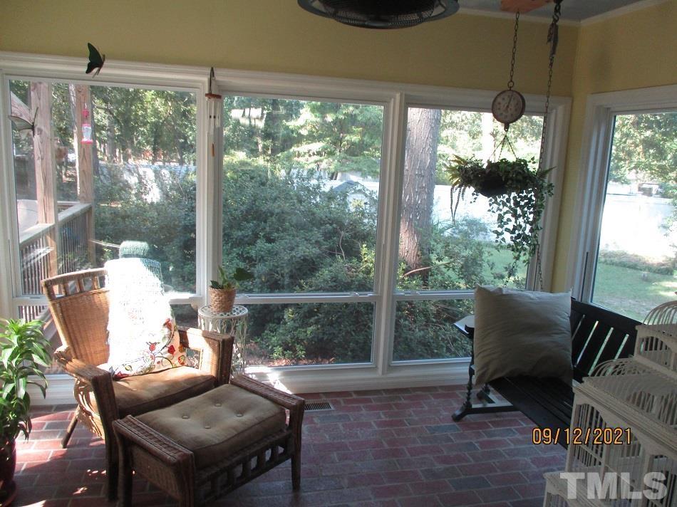 91 Boykin Road Clinton, NC 28328 - Photo 13 of 17 a living room with furniture and a floor to ceiling window