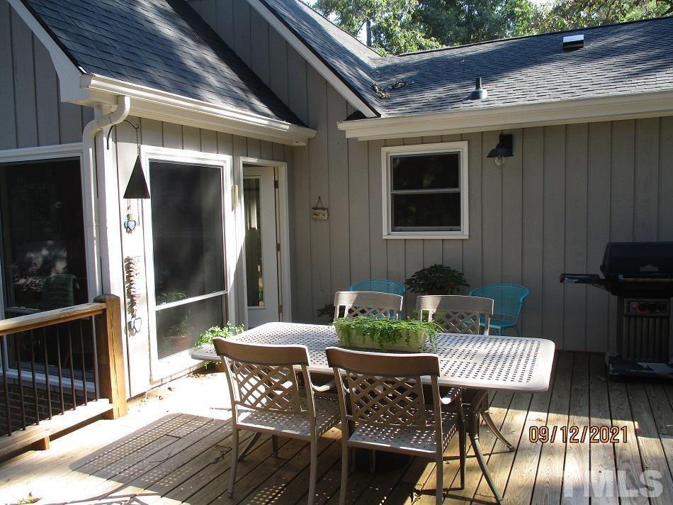 91 Boykin Road Clinton, NC 28328 - Photo 16 of 17 a view of a patio with table and chairs and potted plants