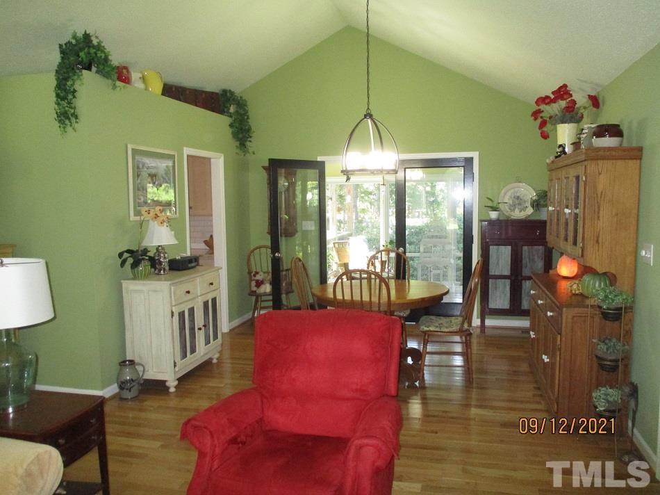 91 Boykin Road Clinton, NC 28328 - Photo 5 of 17 a living room with furniture and a chandelier