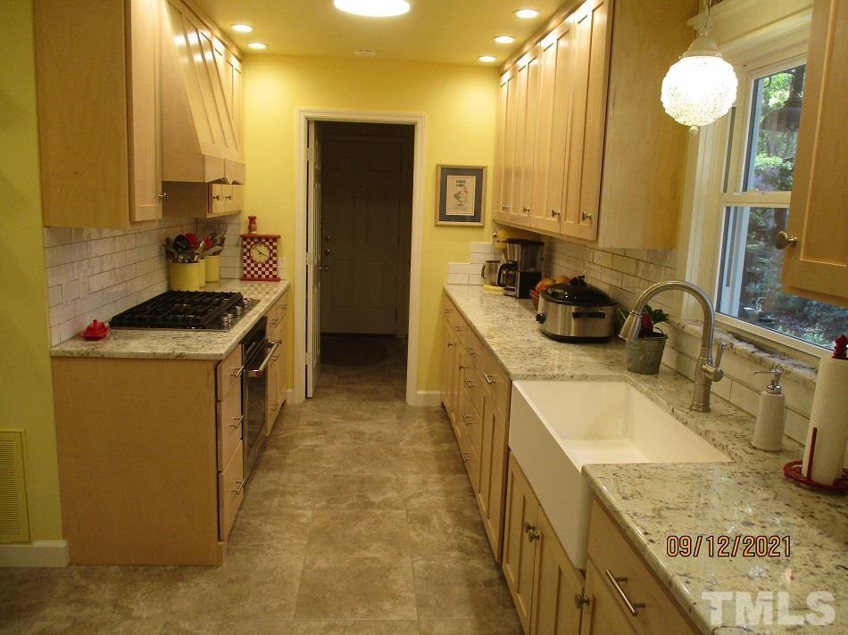 91 Boykin Road Clinton, NC 28328 - Photo 6 of 17 a kitchen with a sink stove and refrigerator