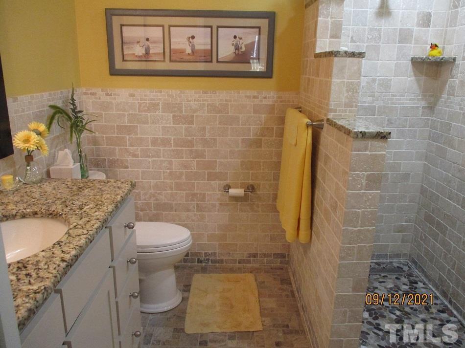 91 Boykin Road Clinton, NC 28328 - Photo 8 of 17 a bathroom with a granite countertop toilet and a sink