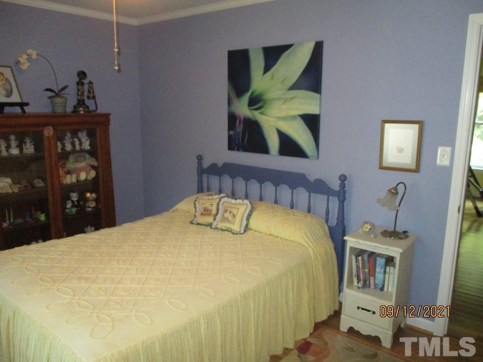 91 Boykin Road Clinton, NC 28328 - Photo 10 of 17 a bedroom with a bed and a mirror