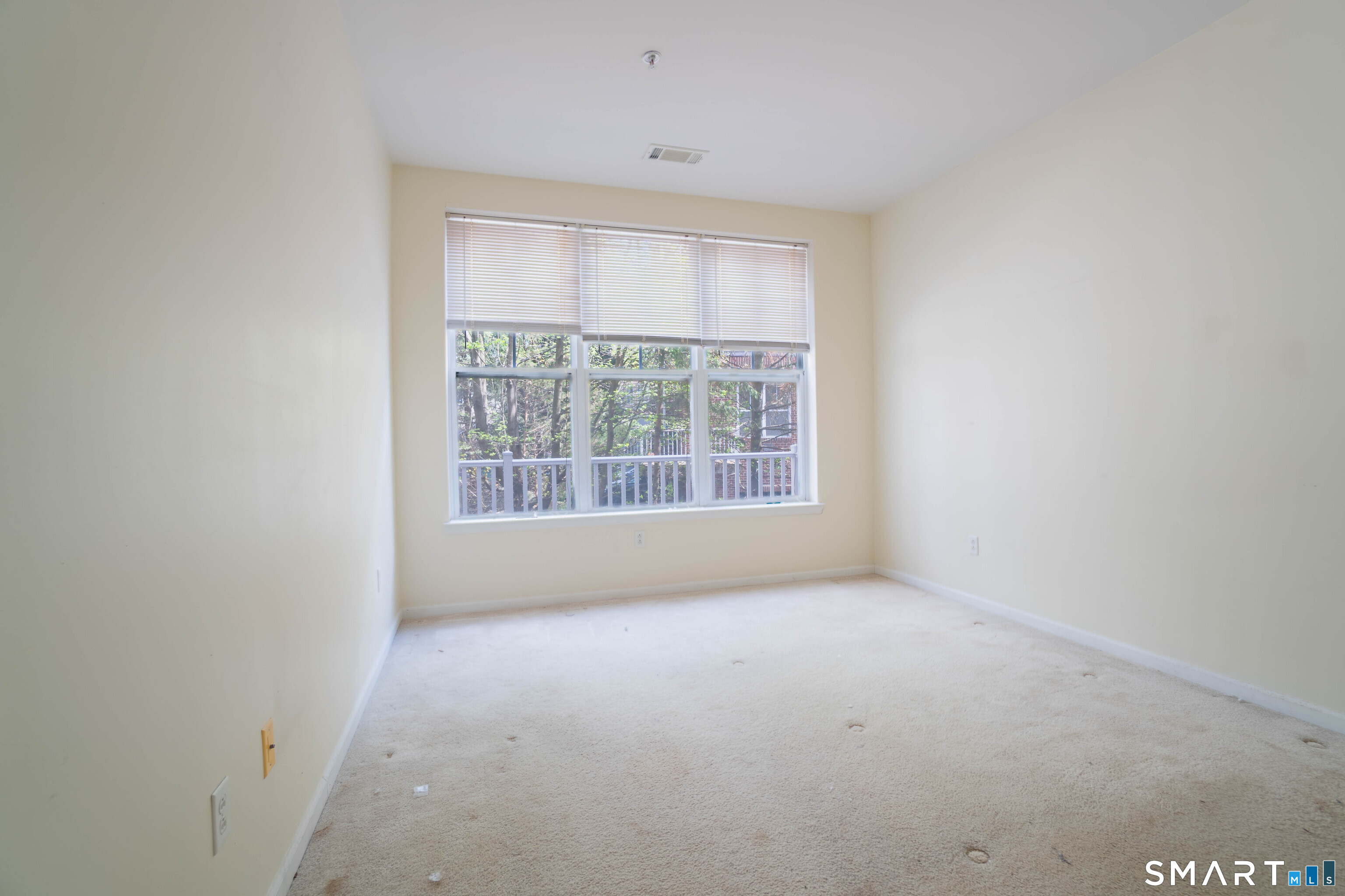 25 Adams Avenue, Unit 112 Stamford, CT 06902 - Photo 13 of 17 a view of an empty room with a window