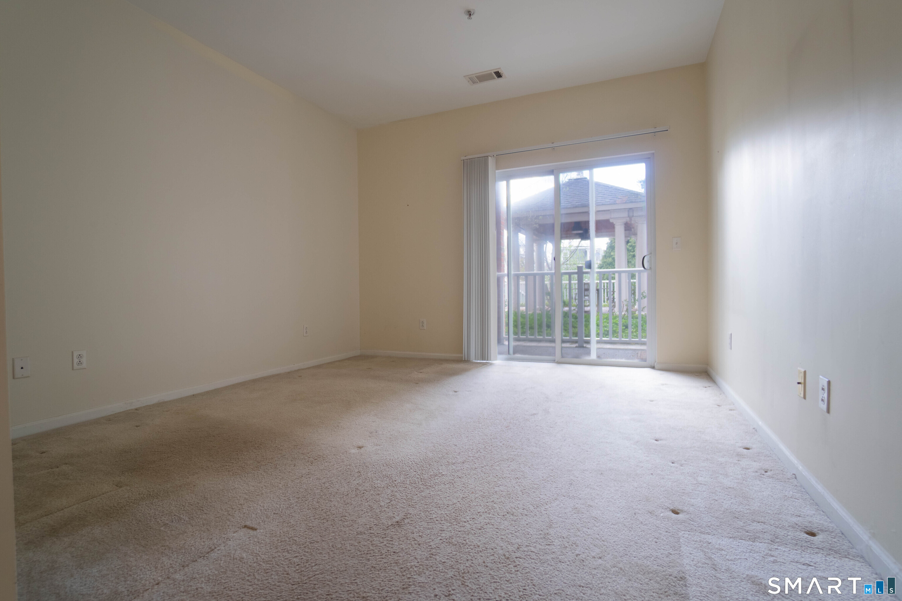 25 Adams Avenue, Unit 112 Stamford, CT 06902 - Photo 16 of 17 wooden floor and window in an empty room