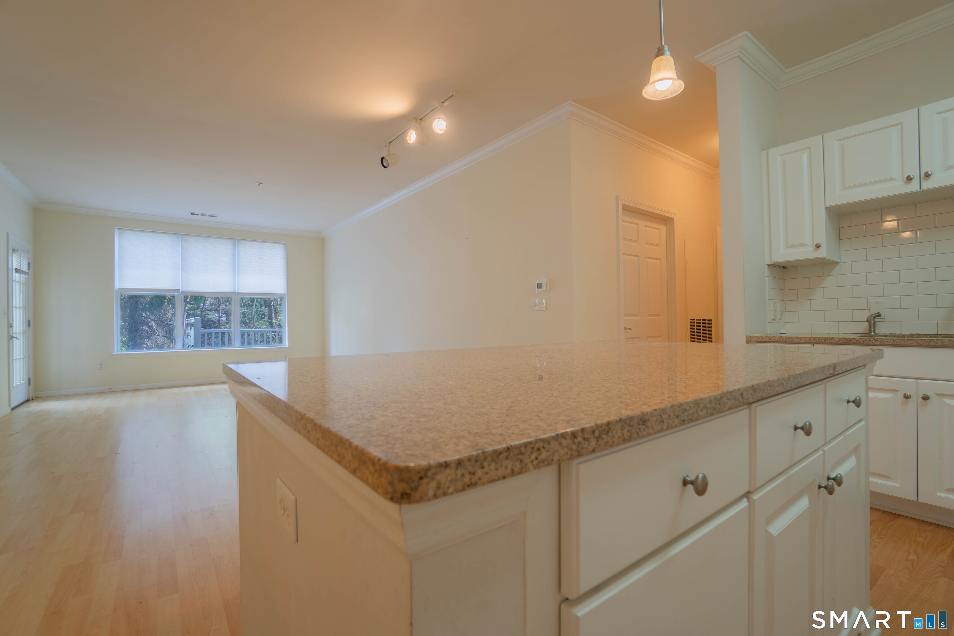 25 Adams Avenue, Unit 112 Stamford, CT 06902 - Photo 7 of 17 a open kitchen with sink and dishwasher with white cabinets