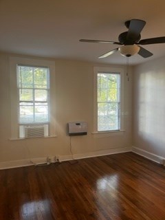 1360 Rhodes Street, Unit D Columbus, GA 31901 - Photo 3 of 11 a view of an empty room with wooden floor and a window