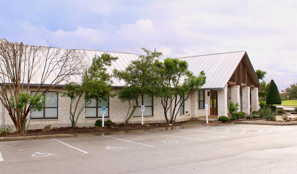 78 Dodder Lane Spring Branch, TX 78070 - Photo 18 of 24 View of building exterior with uncovered parking