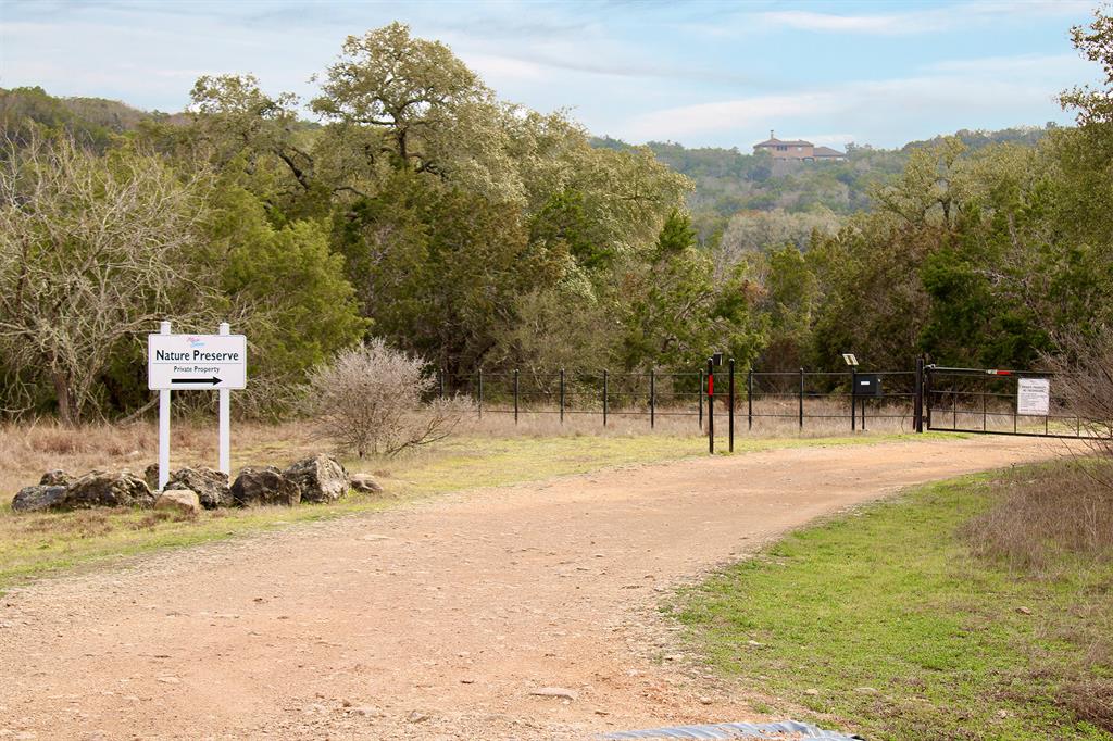 78 Dodder Lane Spring Branch, TX 78070 - Photo 20 of 24 View of dirt / gravel road featuring a view of trees