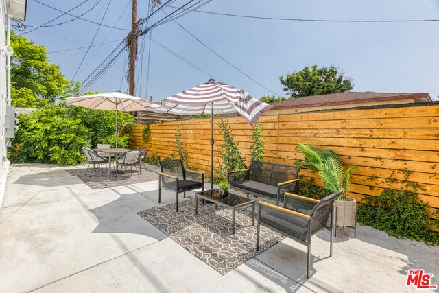 a view of a chairs and table in the patio