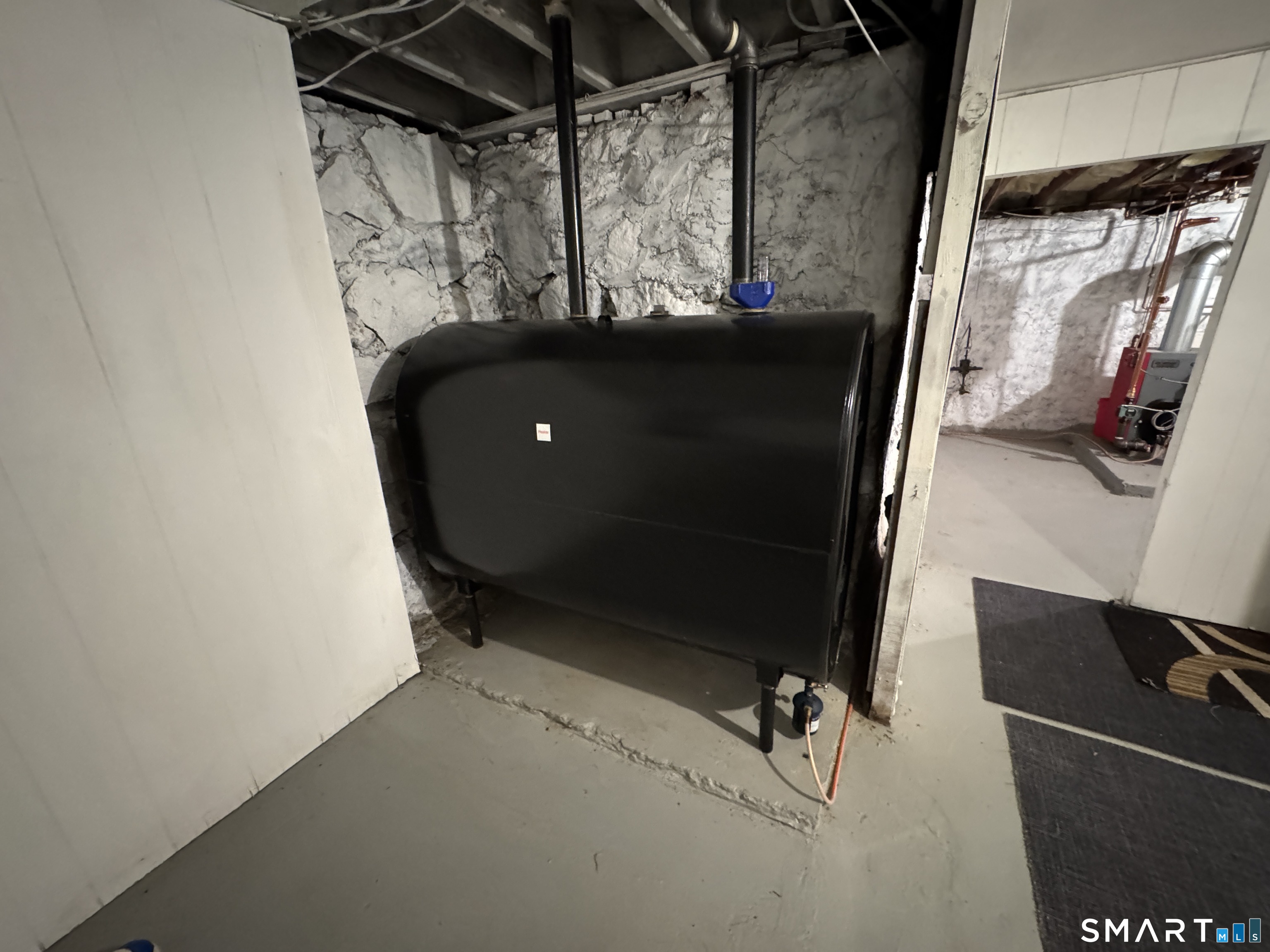 90 Larchmont Avenue Waterbury, CT 06708 - Photo 16 of 26 a room with water heater and window