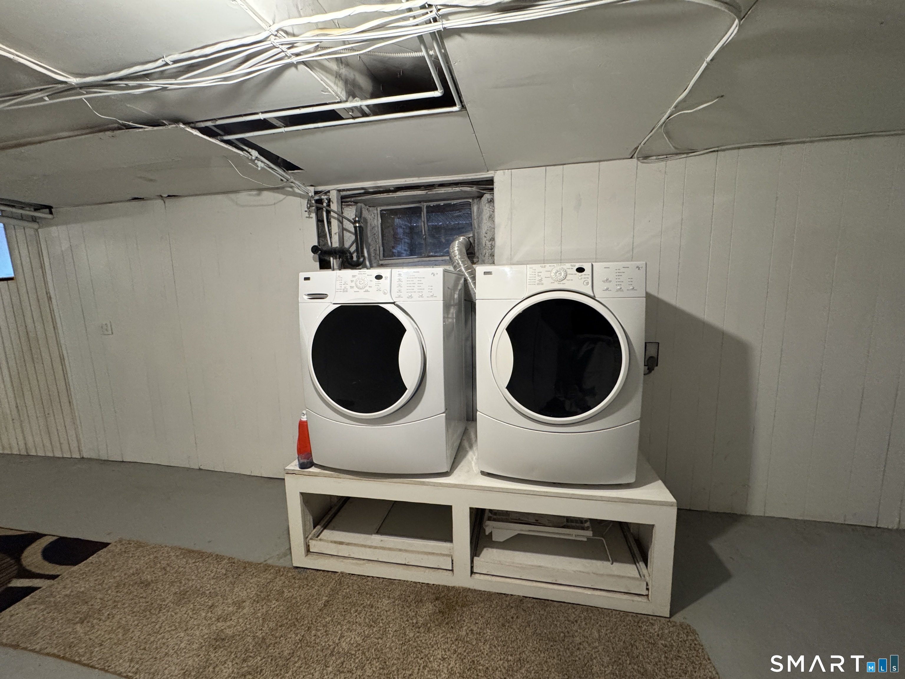 90 Larchmont Avenue Waterbury, CT 06708 - Photo 17 of 26 a utility room with dryer and washer