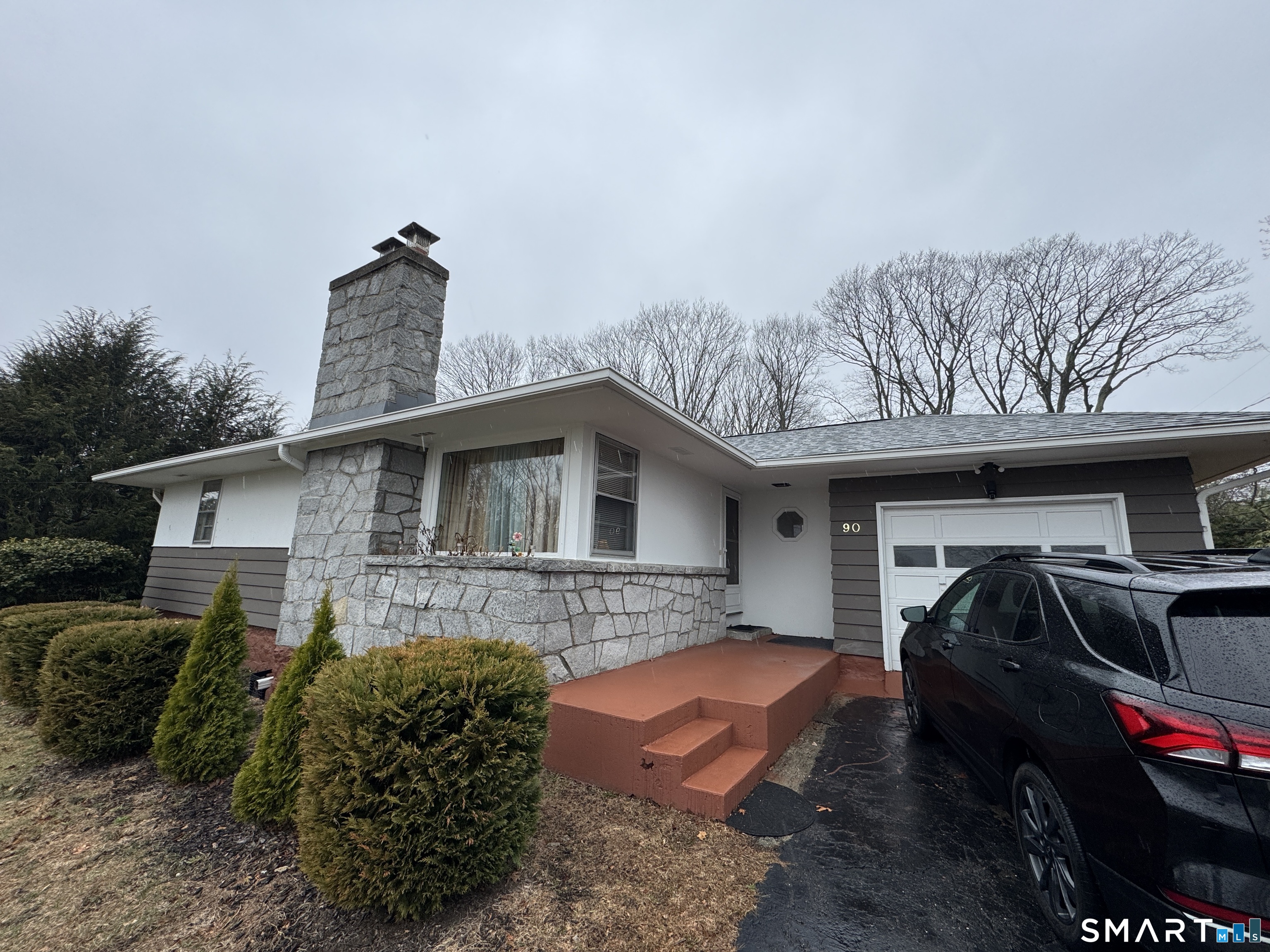 90 Larchmont Avenue Waterbury, CT 06708 - Photo 2 of 26 a front view of a house with parking space