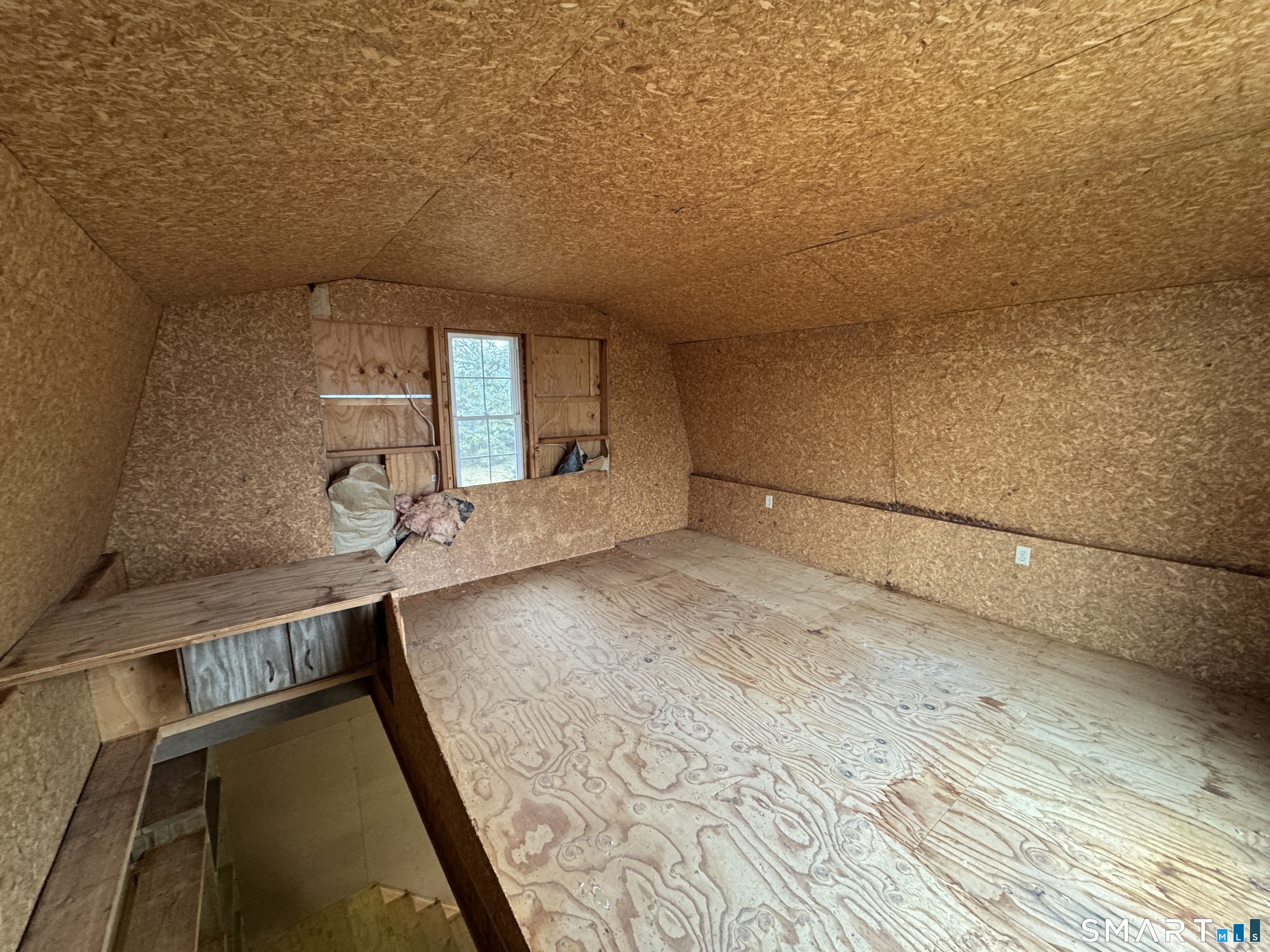 90 Larchmont Avenue Waterbury, CT 06708 - Photo 22 of 26 a view of a room with wooden floor and staircase