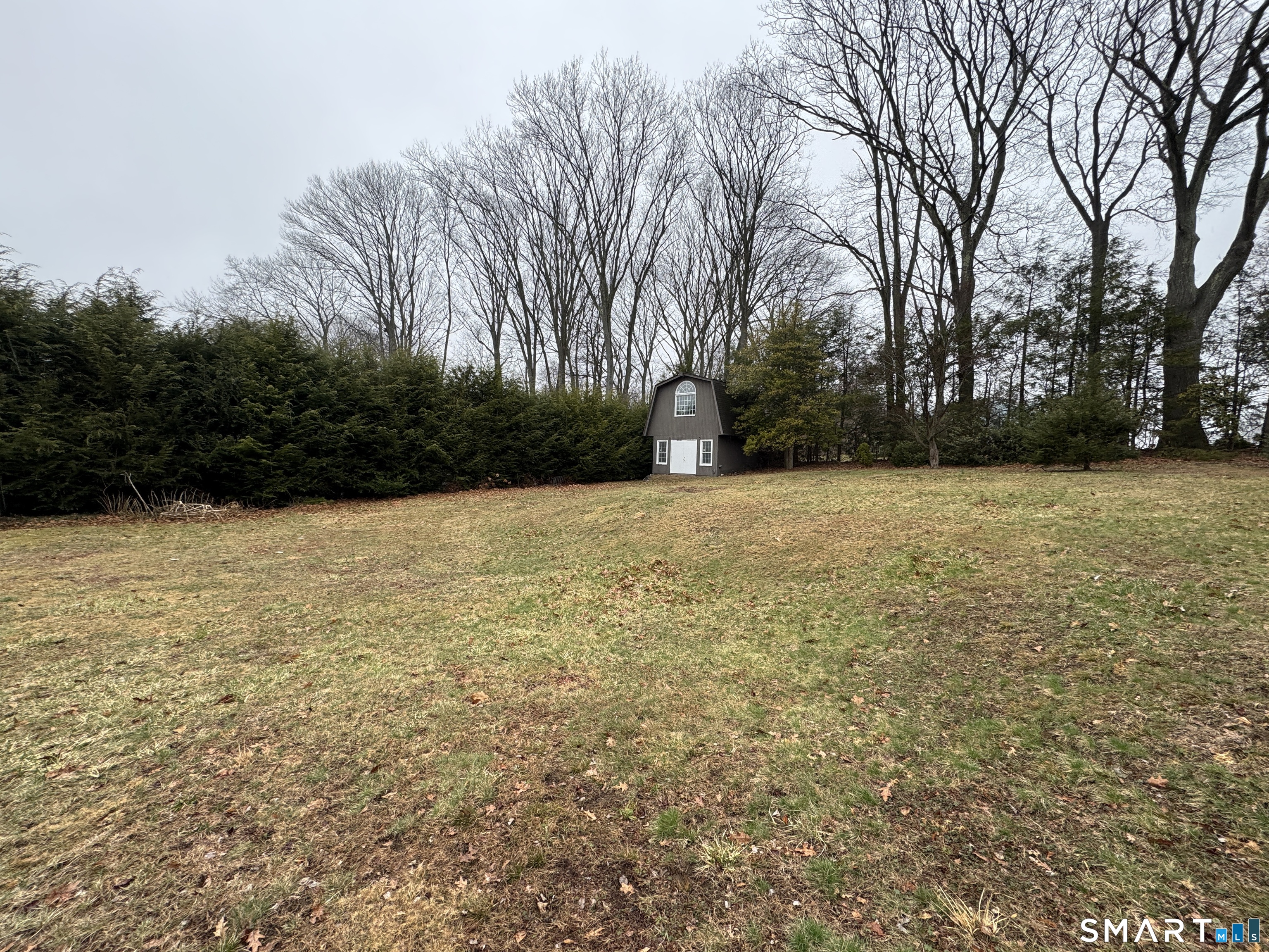 90 Larchmont Avenue Waterbury, CT 06708 - Photo 6 of 26 a view of patio with a yard