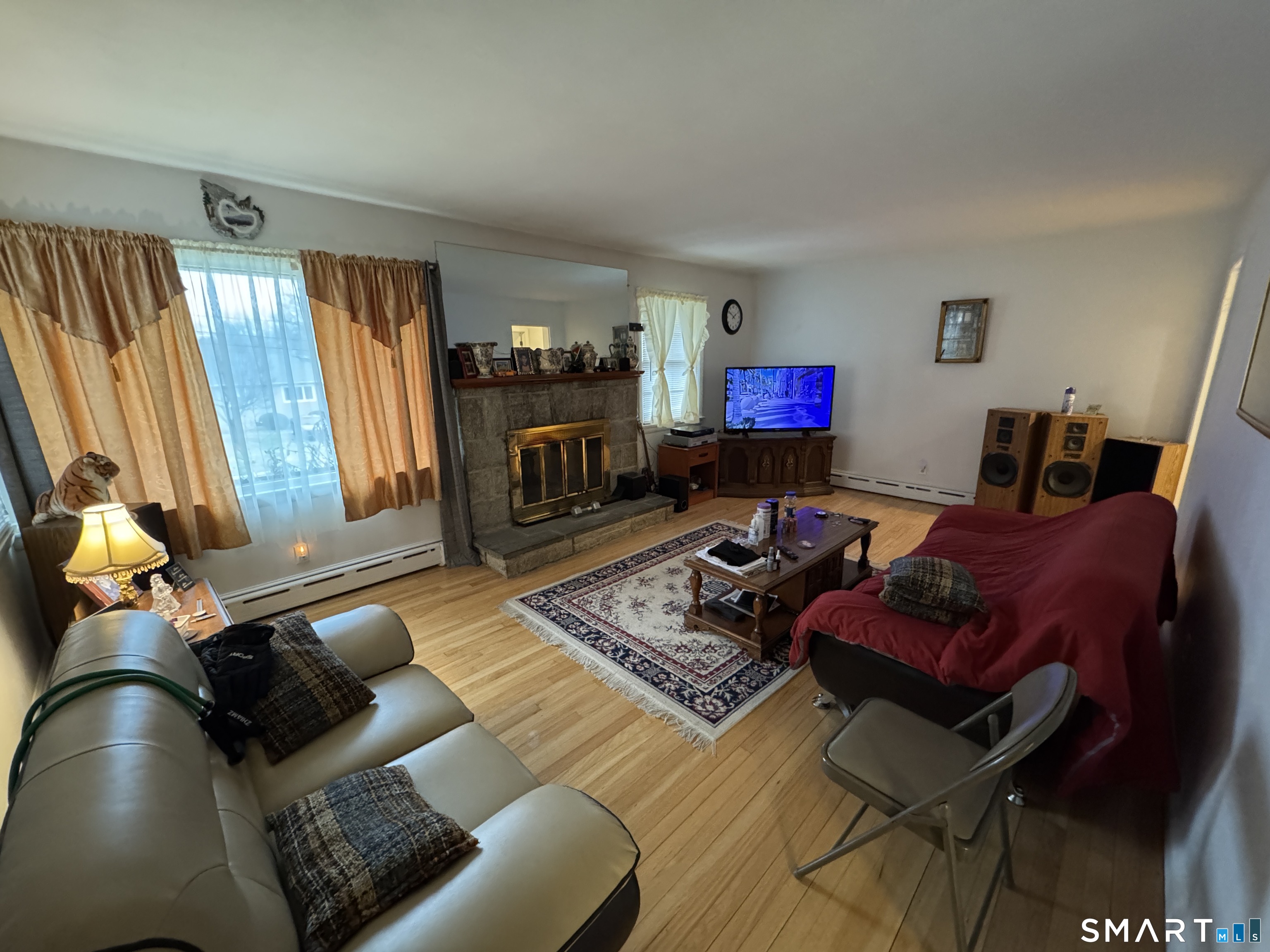90 Larchmont Avenue Waterbury, CT 06708 - Photo 7 of 26 a living room with furniture rug and window