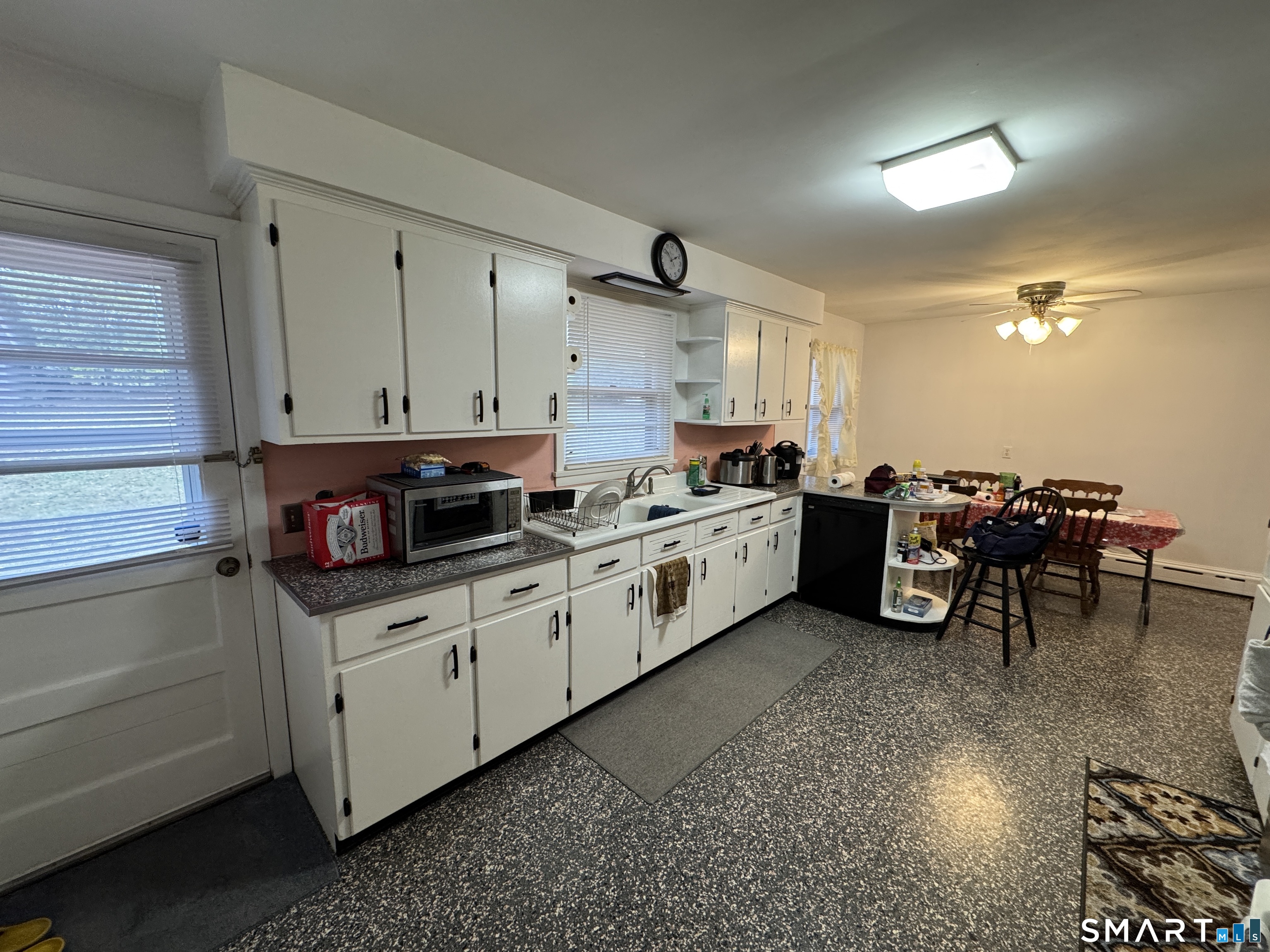 90 Larchmont Avenue Waterbury, CT 06708 - Photo 9 of 26 a kitchen with a sink and cabinets