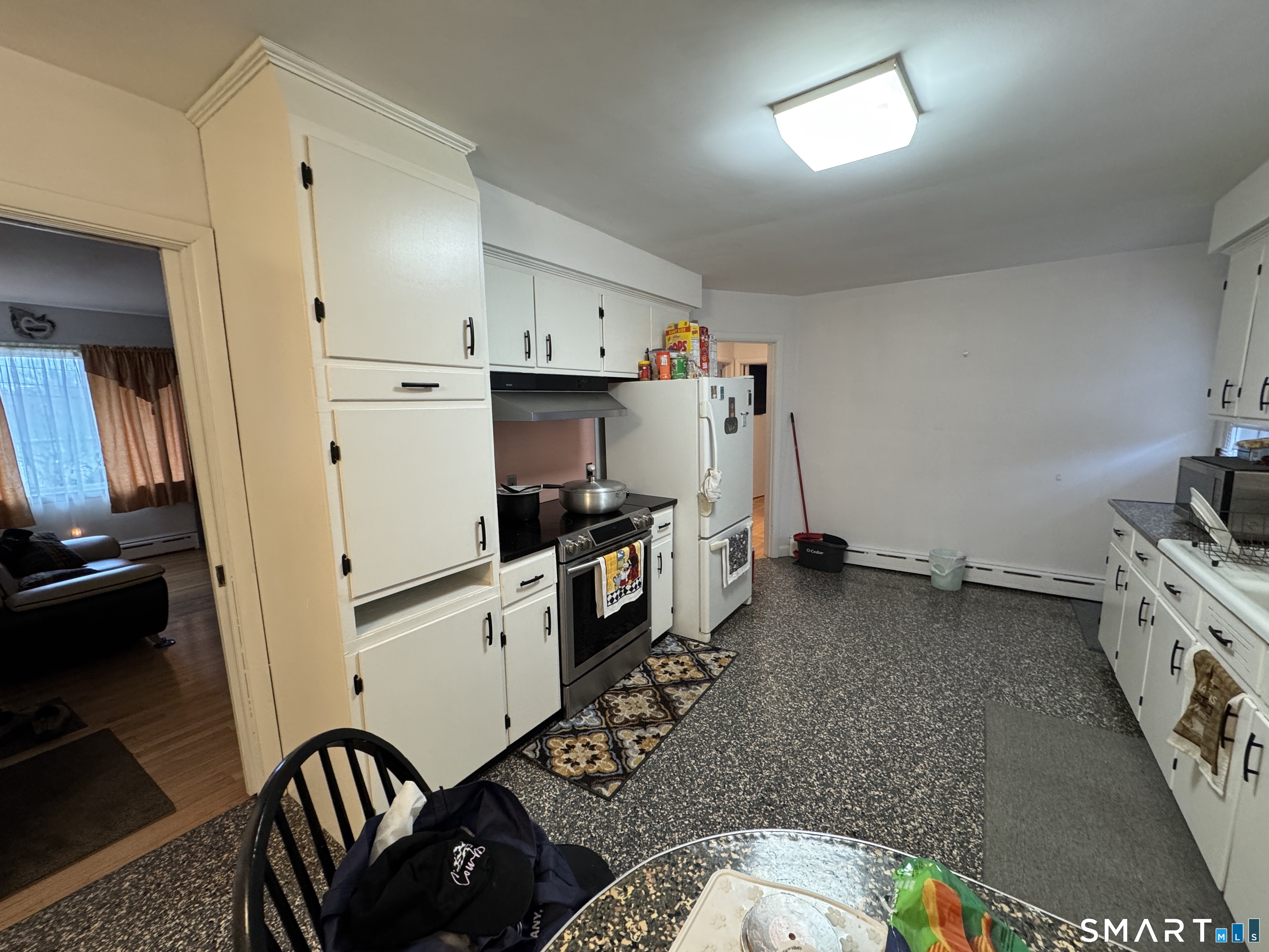 90 Larchmont Avenue Waterbury, CT 06708 - Photo 10 of 26 a kitchen with sink cabinets and appliances