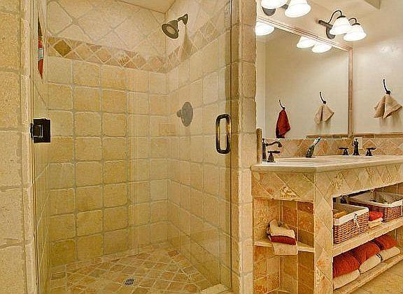 11394 Saddle Road Monterey, CA 93940 - Photo 14 of 33 a bathroom with a sink mirror and shower