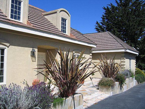11394 Saddle Road Monterey, CA 93940 - Photo 15 of 33 a front view of a house with garden