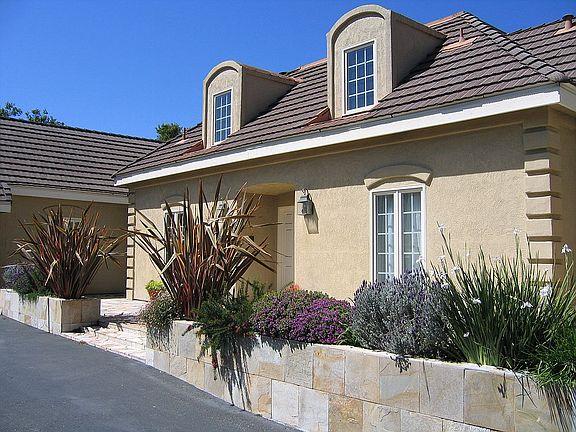 11394 Saddle Road Monterey, CA 93940 - Photo 16 of 33 a potted plant sitting in front of a house
