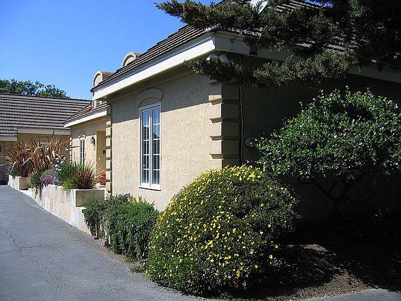 11394 Saddle Road Monterey, CA 93940 - Photo 27 of 33 a view of a house with a flower garden