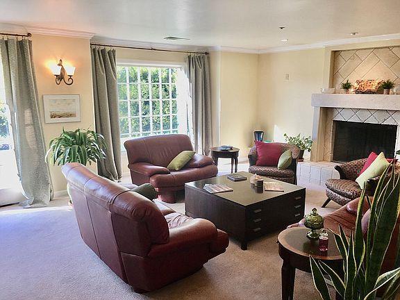 11394 Saddle Road Monterey, CA 93940 - Photo 5 of 33 a living room with furniture and a large window