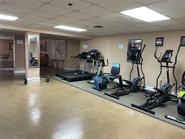 a room with gym equipment and gym equipment