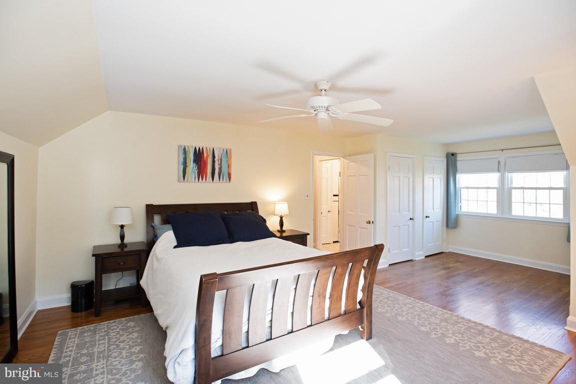 304 Cedarcroft Road Baltimore, MD 21212 - Photo 18 of 39 a bedroom with a large bed and a chandelier