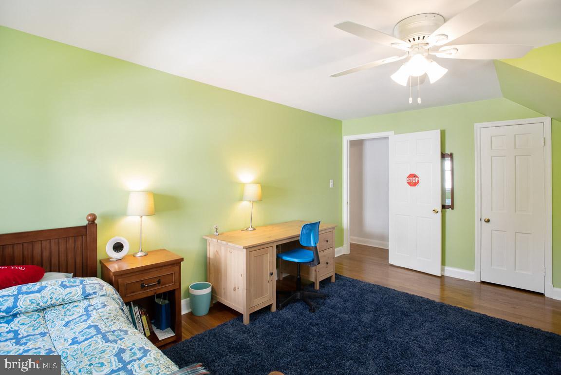 304 Cedarcroft Road Baltimore, MD 21212 - Photo 27 of 39 a bed room with a bed and a chandelier