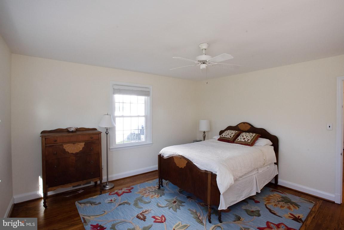 304 Cedarcroft Road Baltimore, MD 21212 - Photo 29 of 39 a bedroom with a bed and a window