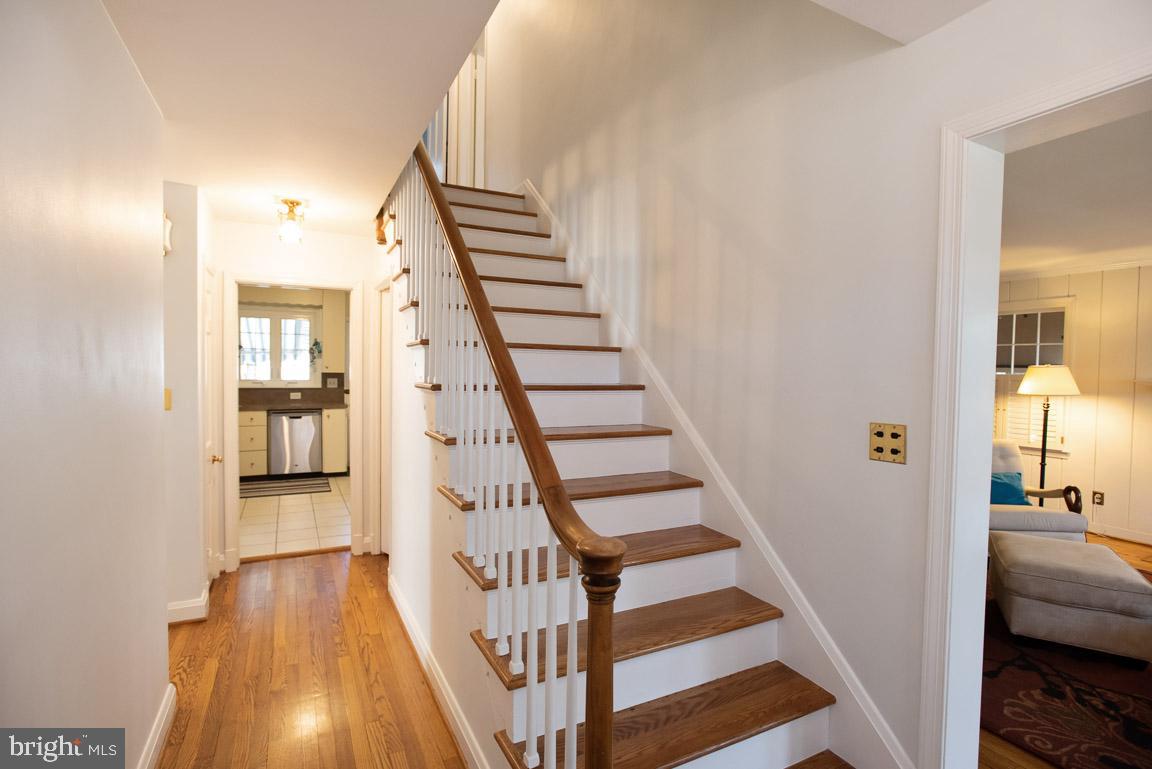 304 Cedarcroft Road Baltimore, MD 21212 - Photo 4 of 39 a view of a hallway with wooden floor and entryway