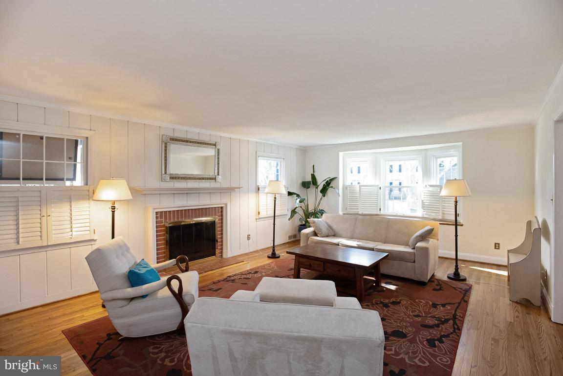 304 Cedarcroft Road Baltimore, MD 21212 - Photo 5 of 39 a living room with furniture and a fireplace