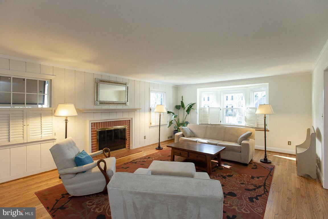 304 Cedarcroft Road Baltimore, MD 21212 - Photo 6 of 39 a living room with furniture and a fireplace