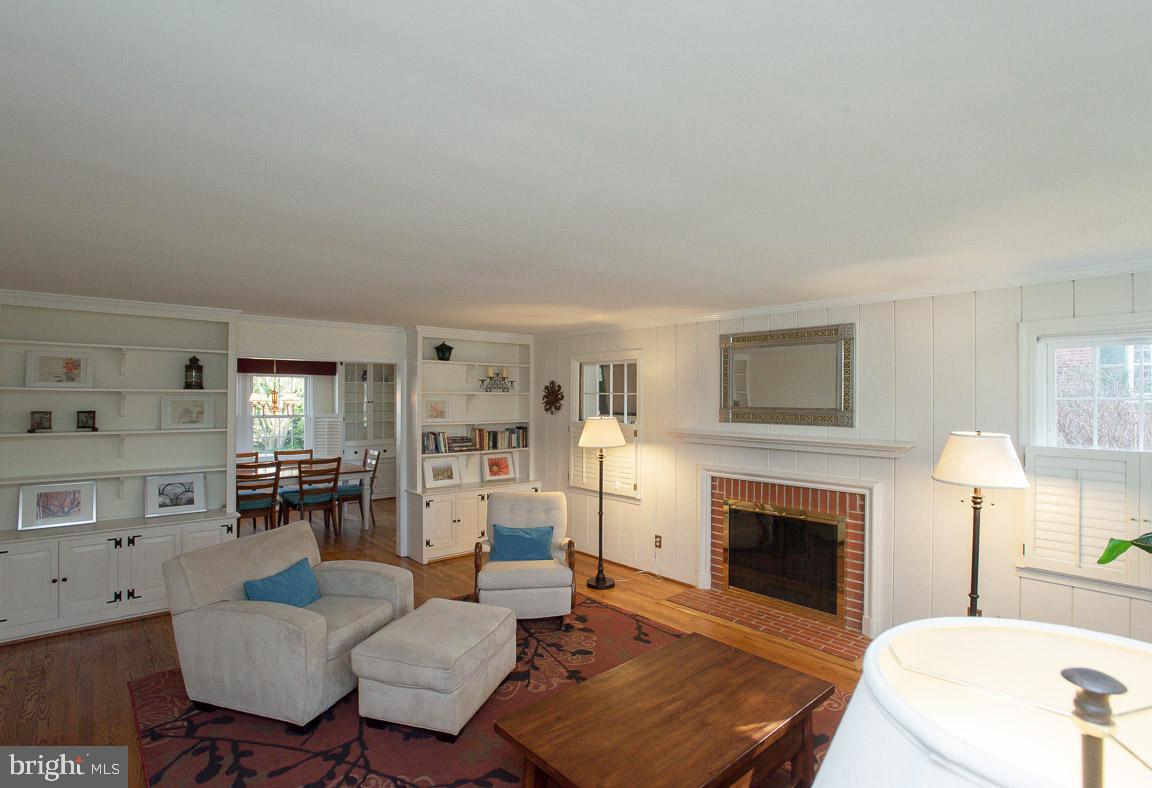 304 Cedarcroft Road Baltimore, MD 21212 - Photo 7 of 39 a living room with furniture a fireplace and a flat screen tv