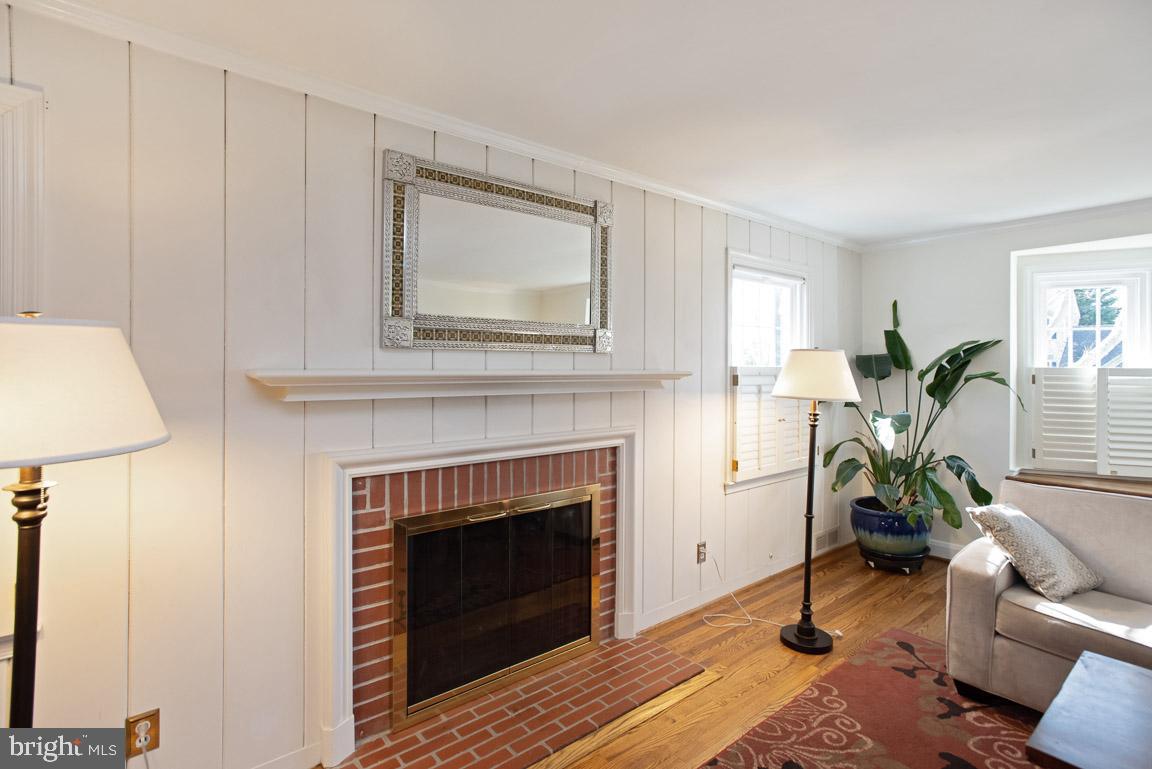 304 Cedarcroft Road Baltimore, MD 21212 - Photo 8 of 39 a living room with furniture and a fireplace