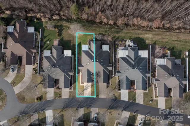 an aerial view of residential house and an outdoor space