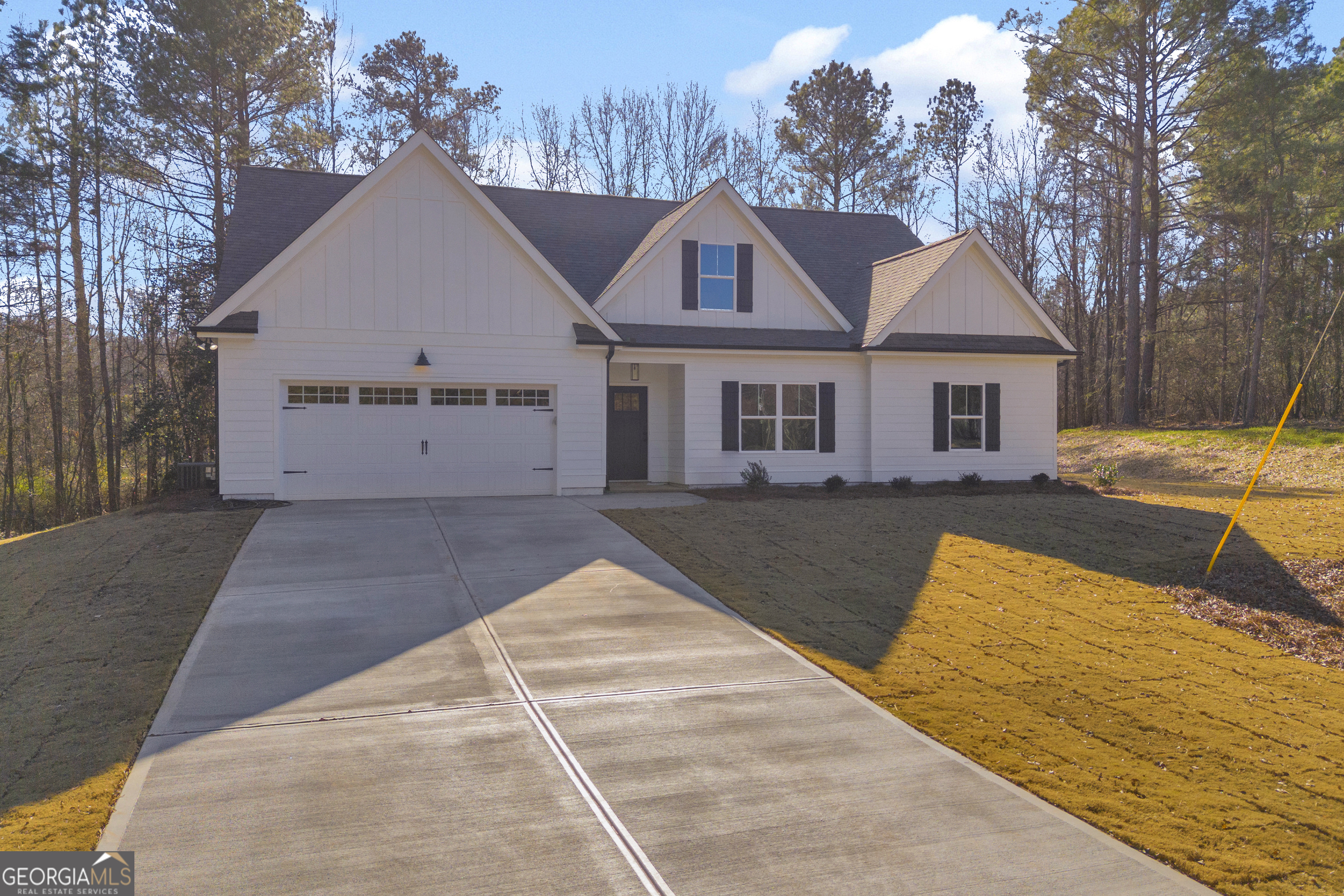 a view of house with yard