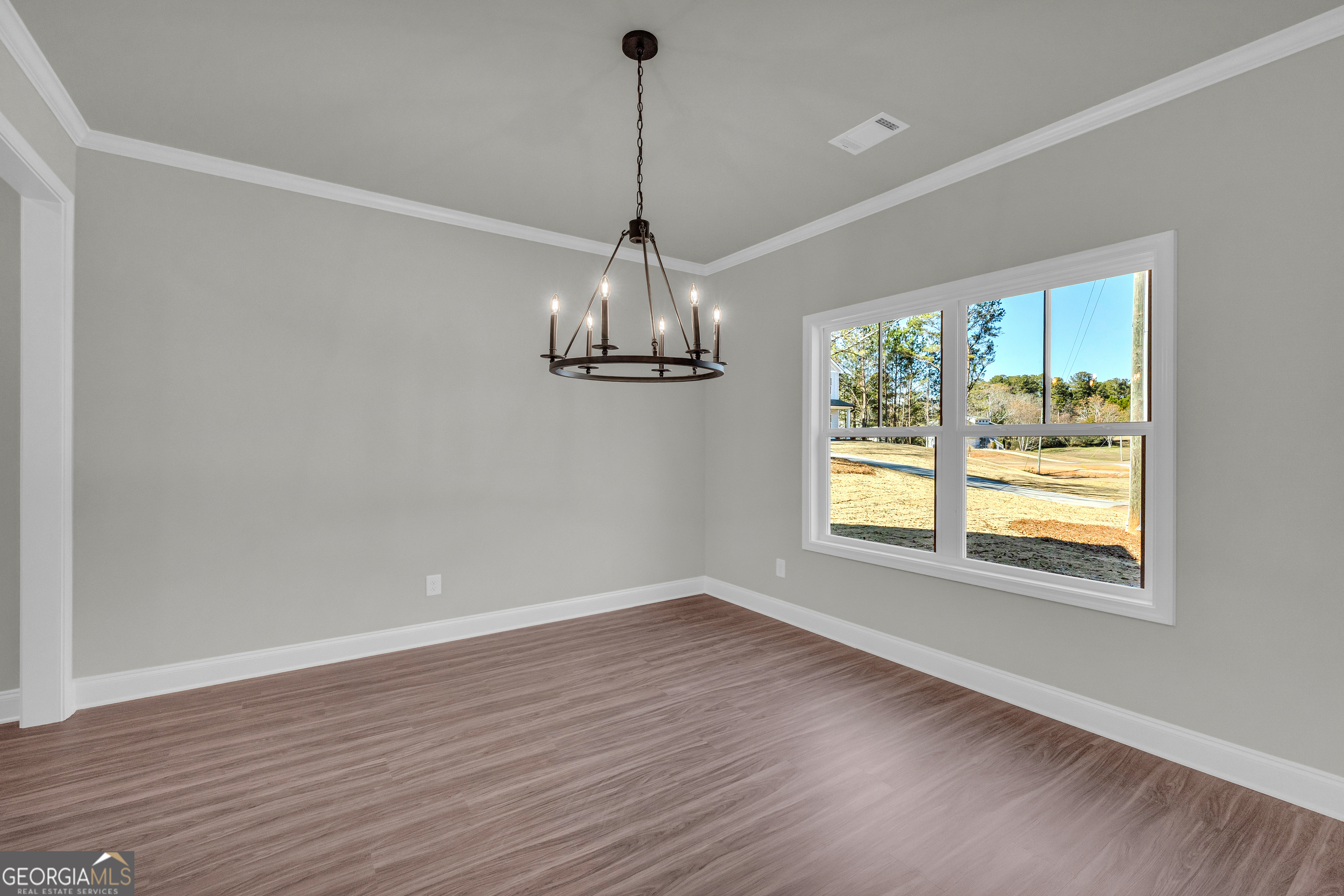174 Old Milltown Road Hartwell, GA 30643 - Photo 12 of 53 a view of a room with window wooden floor and chandelier