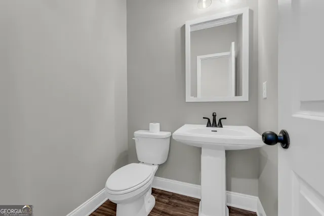 a view of kitchen with cabinets and wooden floor