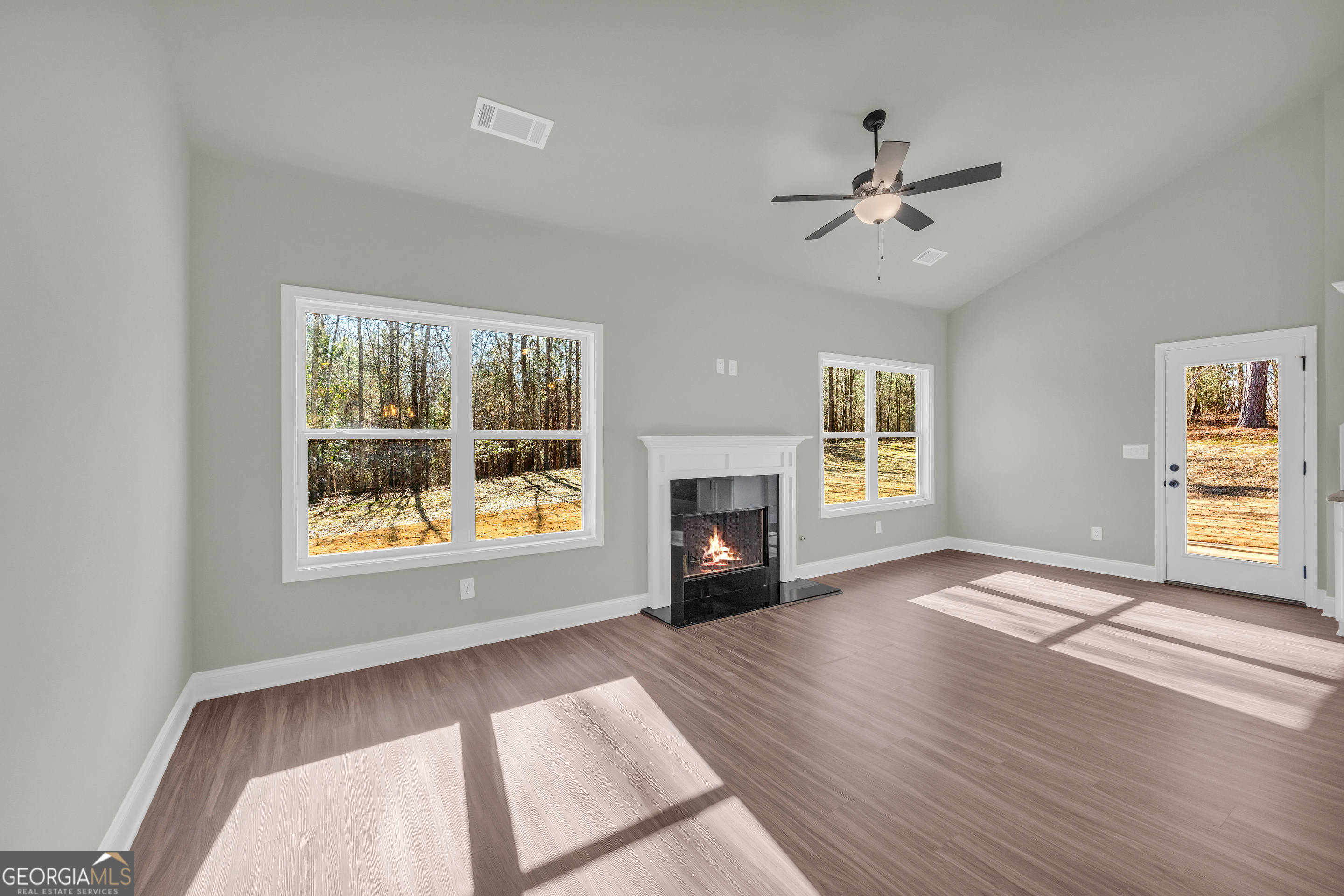 174 Old Milltown Road Hartwell, GA 30643 - Photo 17 of 53 a view of an empty room with a window and fireplace
